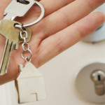 person holding keys in hand